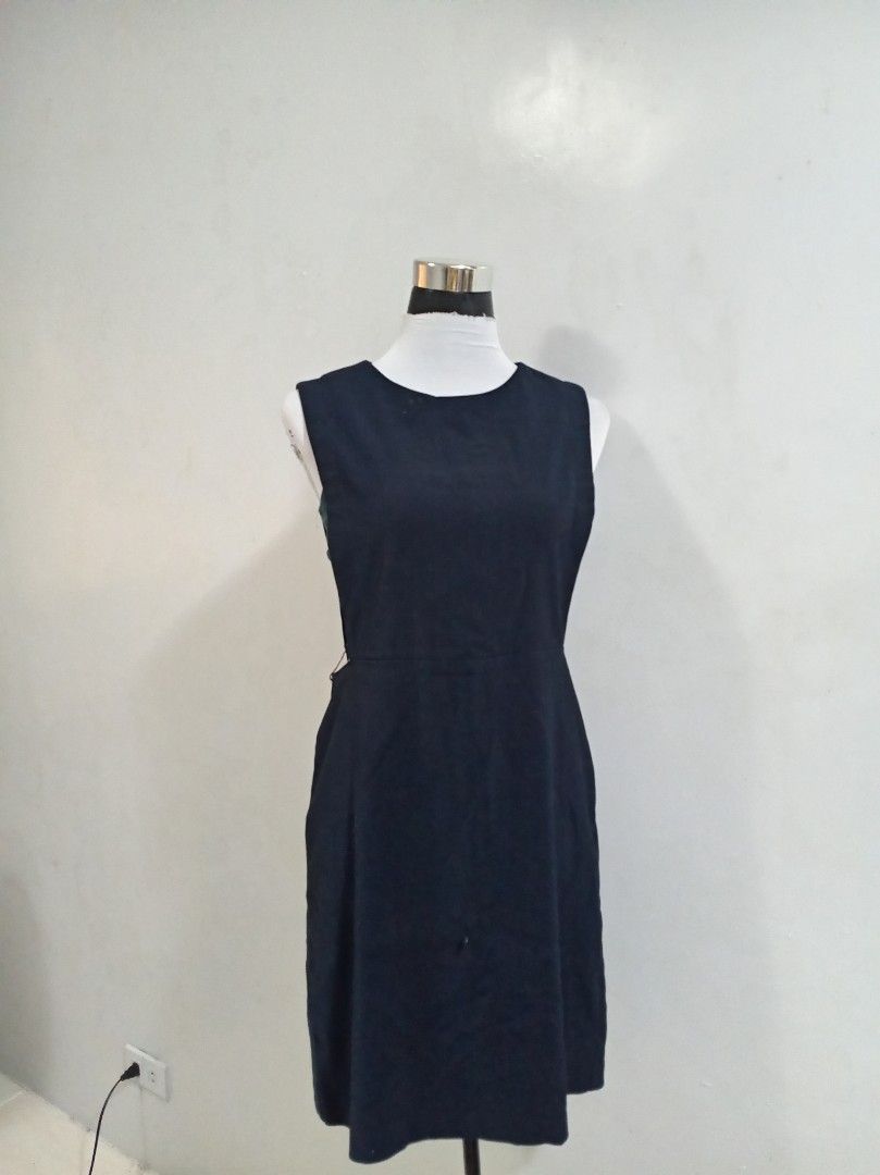 Navy Blue Sleeveless Sheath Dress (Category: Dresses) located in Paranaque City. Submitted by janella11 (Listing ID 1463181038, Image 2). Description: - Navy blue sleeveless dress - Knee-length sheath silhouette - Simple round neckline - Versatile for work or casual outings - Easy to style.