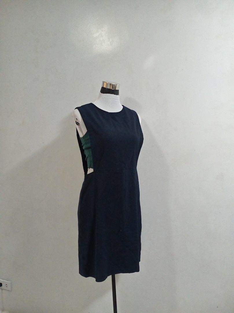 Navy Blue Sleeveless Sheath Dress (Category: Dresses) located in Paranaque City. Submitted by janella11 (Listing ID 1463181038, Image 1). Description: - Navy blue sleeveless dress - Knee-length sheath silhouette - Simple round neckline - Versatile for work or casual outings - Easy to style.