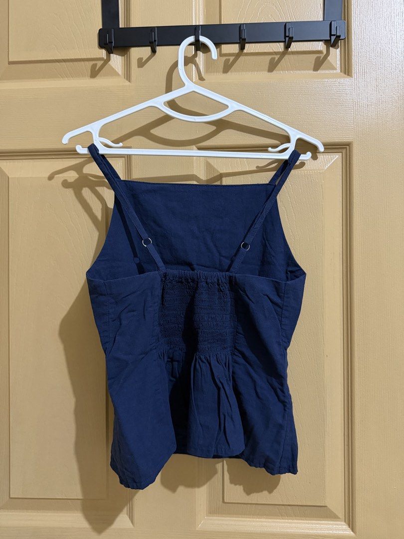 Navy Blue Square Neck Smocked Back Crop Top (Category: Sleeveless) located in Manila. Submitted by chavirly (Listing ID 1463267433, Image 2). Description: - Navy blue crop top - Square neckline with adjustable straps - Smocked back for a comfortable, flexible fit - Estimated size: Small to Medium - Perfect for casual outings or dressing up.