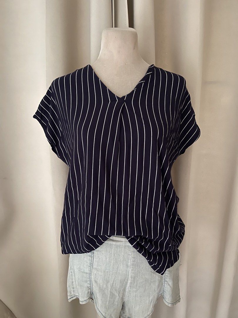 Navy stripes- premium top (Category: Blouses) located in Cainta. Submitted by zlove111 (Listing ID 1463175161, Image 1). Description: - Navy blue top with white vertical stripes - V-neckline with a subtle front twist detail - Comfortable cap sleeves - Loose and flowy silhouette for a relaxed fit - Versatile for casual outings or dressing up xl up to 42 bust 36 waist large-semi xxl .