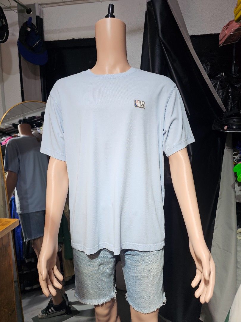 NBA Mini Logo Patch Crewneck T-Shirt (Category: Tshirts & Polo Shirts ) located in Baguio. Submitted by kayeonlineshop (Listing ID 1463171492, Image 1). Description: -light blue short-sleeve crewneck T-shirt featuring a small NBA logo patch on the chest. -Measurements included in the photos.