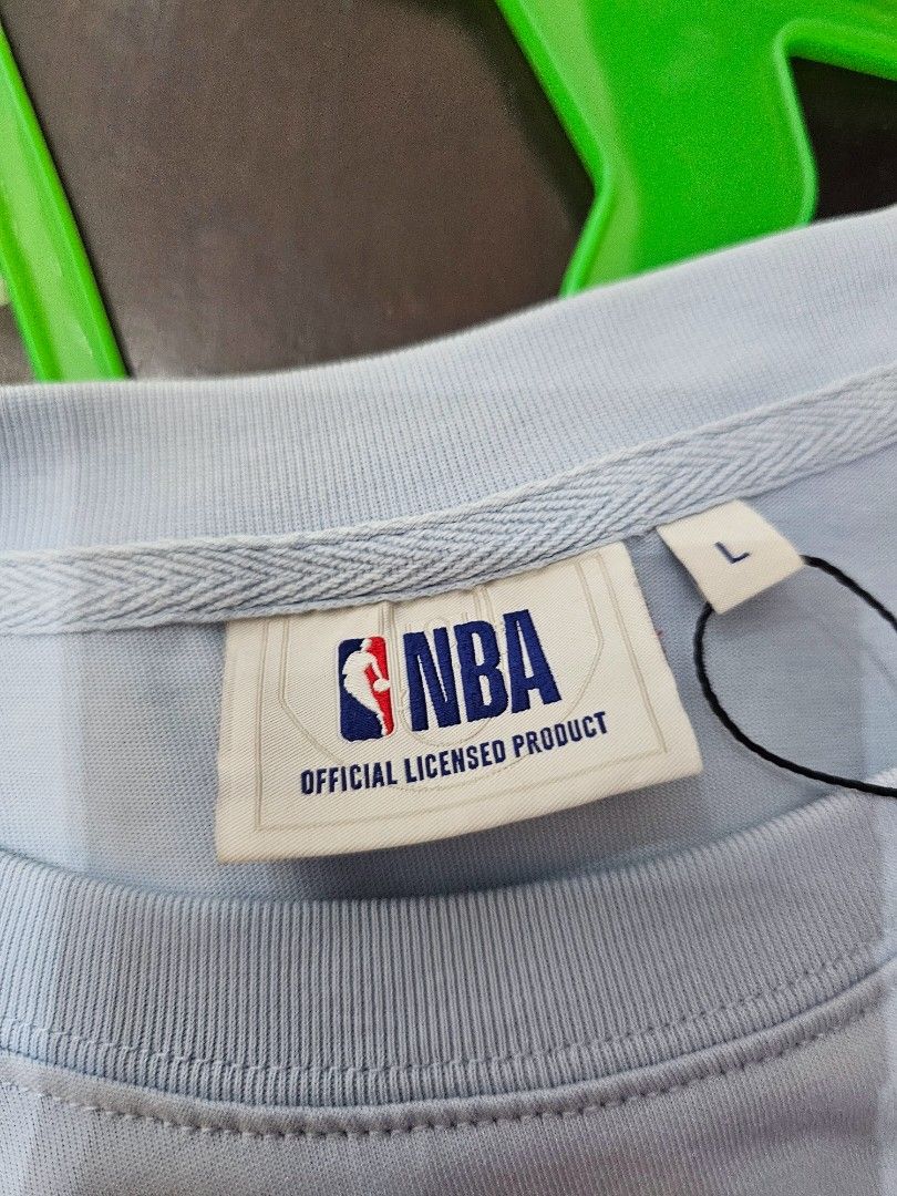 NBA Mini Logo Patch Crewneck T-Shirt (Category: Tshirts & Polo Shirts ) located in Baguio. Submitted by kayeonlineshop (Listing ID 1463171492, Image 3). Description: -light blue short-sleeve crewneck T-shirt featuring a small NBA logo patch on the chest. -Measurements included in the photos.