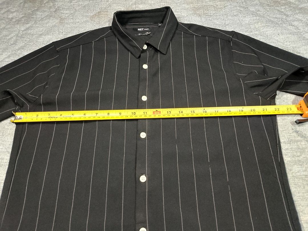 Net men black pinstripe button down short sleeve shirt (Category: Tshirts & Polo Shirts ) located in Cadiz. Submitted by comradstuff (Listing ID 1463128889, Image 2). Description: Net men black pinstripe button down short sleeve shirt w 22" l 28".