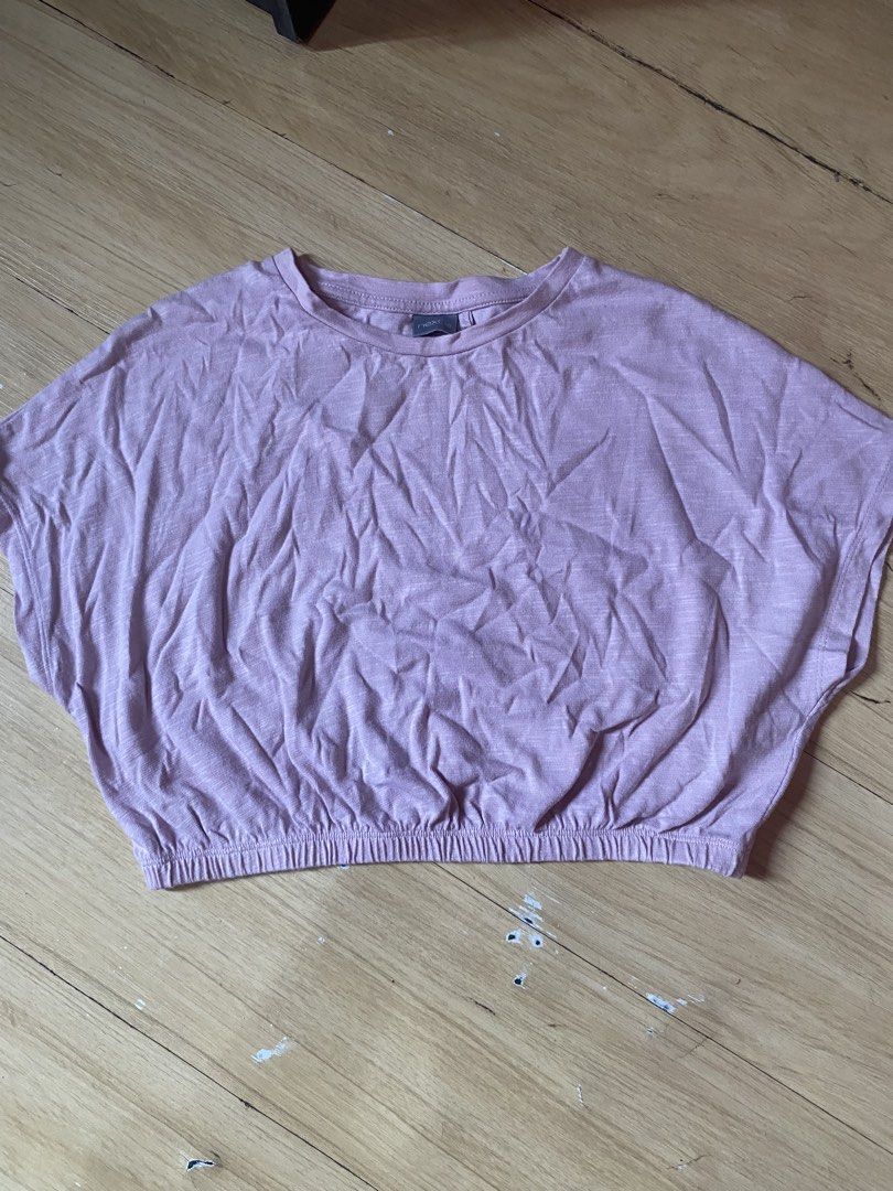 NEXT Pink Cropped Dolman Sleeve Top (Category: Blouses) located in Tanauan. Submitted by rie098 (Listing ID 1463277339, Image 1). Description: - Brand: NEXT - Style: Cropped Top - Features: Dolman sleeves for a relaxed fit - Detail: Elasticated hem - Material: Lightweight fabric - Occasion: Perfect for casual wear.