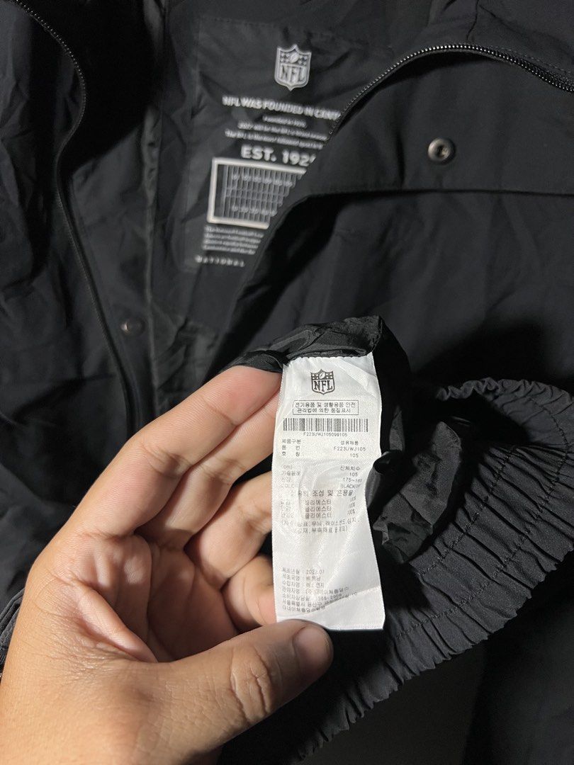 NFL WINDBREAKER (Category: Hoodies) located in Panabo. Submitted by lloydskiee_ni_bai (Listing ID 1463153768, Image 3). Description: 🏈 NFL TEAM APPAREL HOODED WINDBREAKER / CARGO JACKET 🏈 Brand: Official NFL Team Apparel Color: Solid Black Size on Tag: XL Dimensions: Width 25” | Length 28” Condition: Excellent / Like New condition (clean cuffs, hardware, and tags) Details: • Classic embroidered NFL branding and sleeve patch • Heavyweight hooded