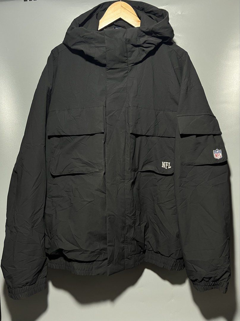 NFL WINDBREAKER (Category: Hoodies) located in Panabo. Submitted by lloydskiee_ni_bai (Listing ID 1463153768, Image 1). Description: 🏈 NFL TEAM APPAREL HOODED WINDBREAKER / CARGO JACKET 🏈 Brand: Official NFL Team Apparel Color: Solid Black Size on Tag: XL Dimensions: Width 25” | Length 28” Condition: Excellent / Like New condition (clean cuffs, hardware, and tags) Details: • Classic embroidered NFL branding and sleeve patch • Heavyweight hooded