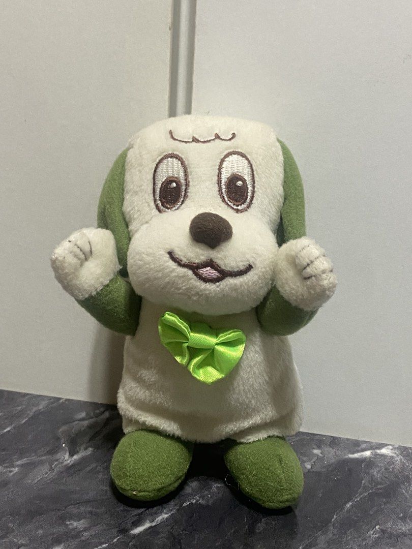 NHK Educational Dog Plush Toy (Category: Plushies & Soft Toys) located in Manila. Submitted by kuya_moto (Listing ID 1463243356, Image 1). Description: - Adorable plush toy dog - Features green ears, feet, and a green bow tie - From NHK Educational - Soft and huggable material - Ideal for collectors or as a thoughtful gift.