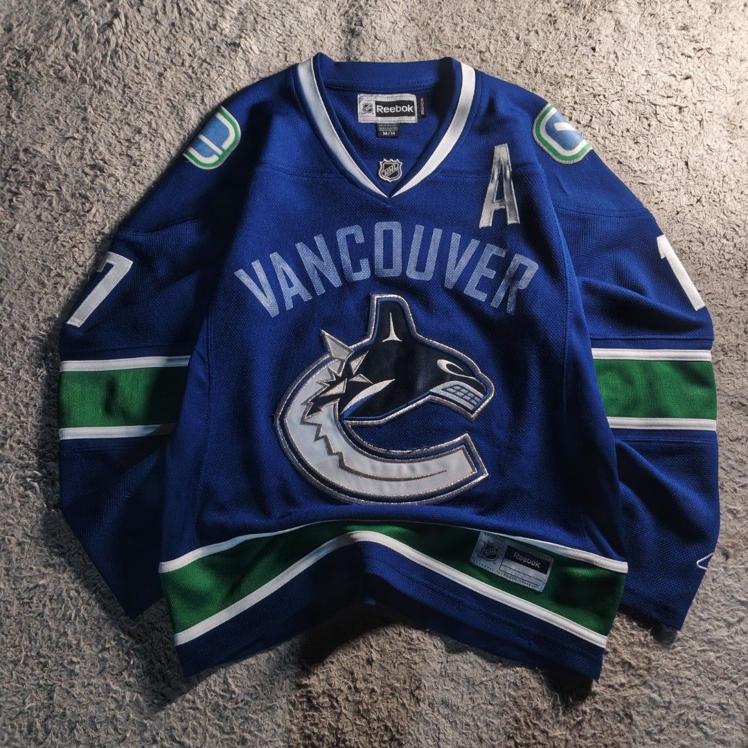 NHL VANCOUVER CANUCKS JERSEY (Category: Coats, Jackets and Outerwear) located in Baguio. Submitted by thrift_arcves (Listing ID 1463277857, Image 1). Description: NHL VANCOUVER CANUCKS JERSEY(WOMENS) Color Rate: 10/10 Condition Rate: 9/10 VANCOUVER PATCH MISSING COLOR MAY VARY DUE TO LIGHTING❗ ALL ITEMS ARE THRIFTED SO LIMIT YOUR EXPECTATIONS❗ DM FOR INQUIRIES❗ PRICE: ₱899 DIME$ Width: 20 Length: 25 M(WOMENS) S(MENS) NEGOTIABLE❗ WAG MAHIYANG MAMB