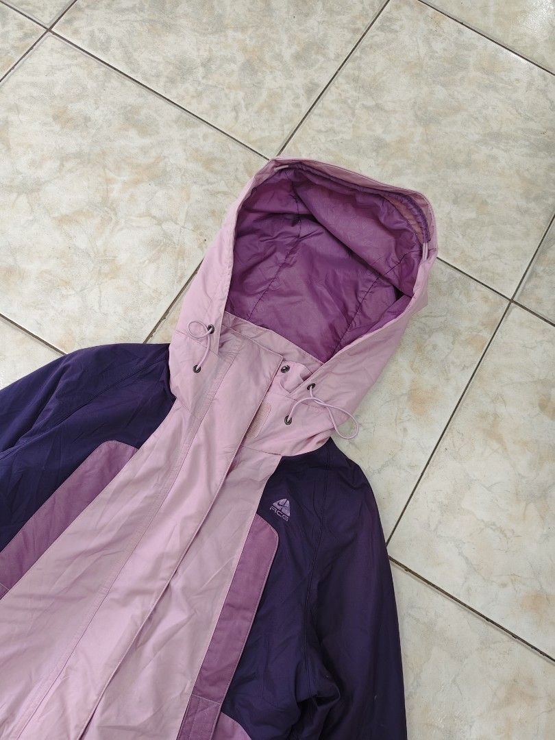 Nike ACG Purple Pink Hooded Jacket (Category: Coats, Jackets and Outerwear) located in Catbalogan. Submitted by yellfindss (Listing ID 1463228638, Image 2). Description: - Nike ACG Jacket - Color: Purple and Pink - Hooded design with adjustable drawstrings - Zipper closure - Two side pockets - Estimated Size: Medium - Ideal for outdoor activities - Condition: Good, ready for a new owner.