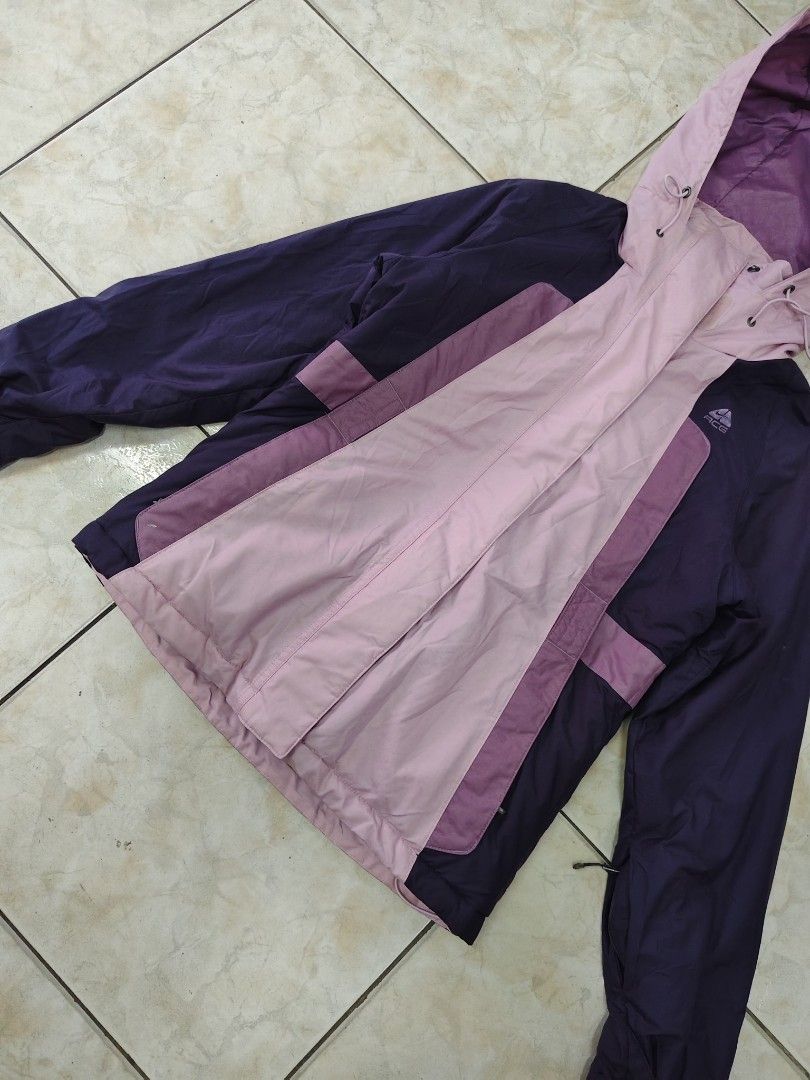 Nike ACG Purple Pink Hooded Jacket (Category: Coats, Jackets and Outerwear) located in Catbalogan. Submitted by yellfindss (Listing ID 1463228638, Image 3). Description: - Nike ACG Jacket - Color: Purple and Pink - Hooded design with adjustable drawstrings - Zipper closure - Two side pockets - Estimated Size: Medium - Ideal for outdoor activities - Condition: Good, ready for a new owner.