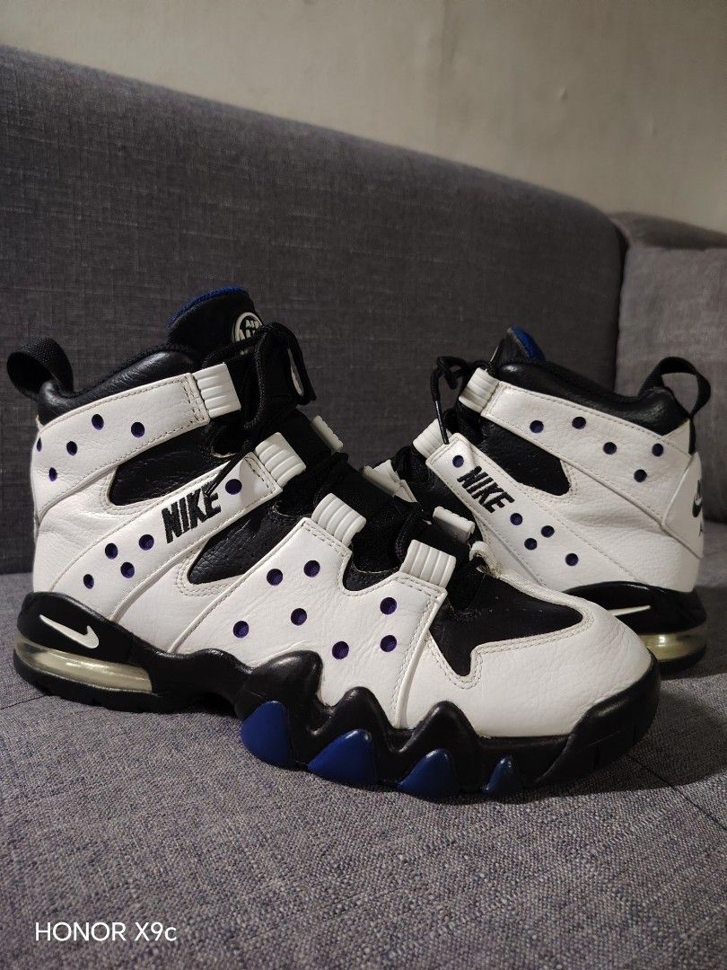 Nike Air Max CB 94 (Category: Sneakers) located in Quezon City. Submitted by 28works (Listing ID 1463261200, Image 1). Description: - Classic Nike Air Max CB 94 - White leather with black and purple accents - High-top design for ankle support - Suitable for basketball or casual wear - Black laces - Black soles with blue detailing.