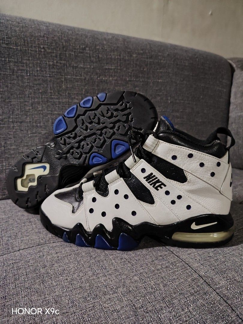 Nike Air Max CB 94 (Category: Sneakers) located in Quezon City. Submitted by 28works (Listing ID 1463261200, Image 3). Description: - Classic Nike Air Max CB 94 - White leather with black and purple accents - High-top design for ankle support - Suitable for basketball or casual wear - Black laces - Black soles with blue detailing.