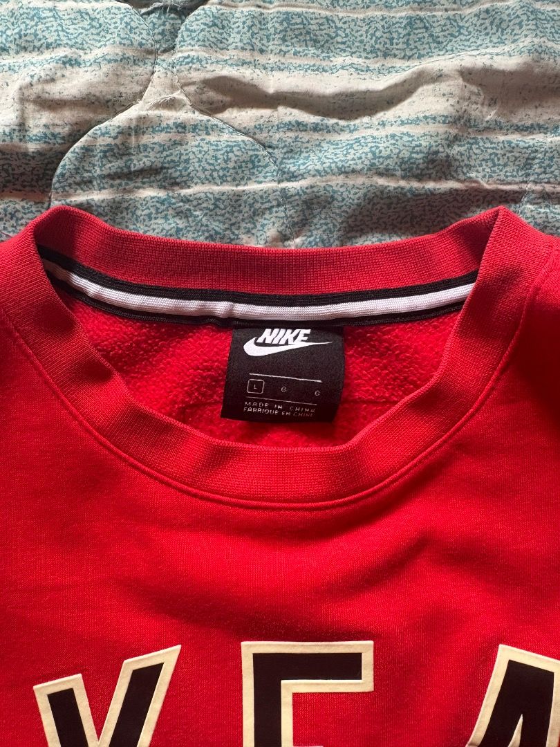 Nike Air Red Crewneck Sweatshirt (Category: Coats, Jackets and Outerwear) located in Baguio. Submitted by ssshhhaae (Listing ID 1463131302, Image 3). Description: - Authentic Nike Air crewneck sweatshirt - Features the classic Nike Air logo prominently on the chest - Ribbed cuffs and hem for a comfortable fit - Stylish white stripe detail on cuffs and hem - Ideal for everyday casual wear.