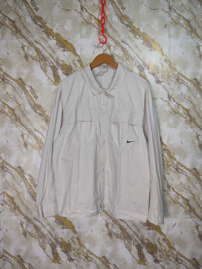 Nike Beige Lightweight Jacket with Swoosh Logo (Category: Coats, Jackets and Outerwear) located in Cabuyao City. Submitted by jederama (Listing ID 1463151967, Image 1). Description: NIKE WOVEN LONGSLEEVE AUTUMN SIZE : BEST FIT XL WIDTH - 23.5 LENGTH - 27 EXCELLENT CONDITION NO ISSUE / NO FLAWS AUTHENTIC 💯 1,200 + SHIPPING FEE.