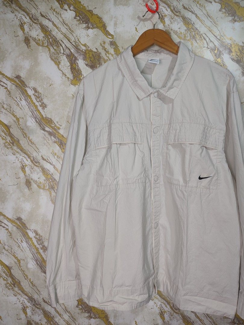 Nike Beige Lightweight Jacket with Swoosh Logo (Category: Coats, Jackets and Outerwear) located in Cabuyao City. Submitted by jederama (Listing ID 1463151967, Image 3). Description: NIKE WOVEN LONGSLEEVE AUTUMN SIZE : BEST FIT XL WIDTH - 23.5 LENGTH - 27 EXCELLENT CONDITION NO ISSUE / NO FLAWS AUTHENTIC 💯 1,200 + SHIPPING FEE.