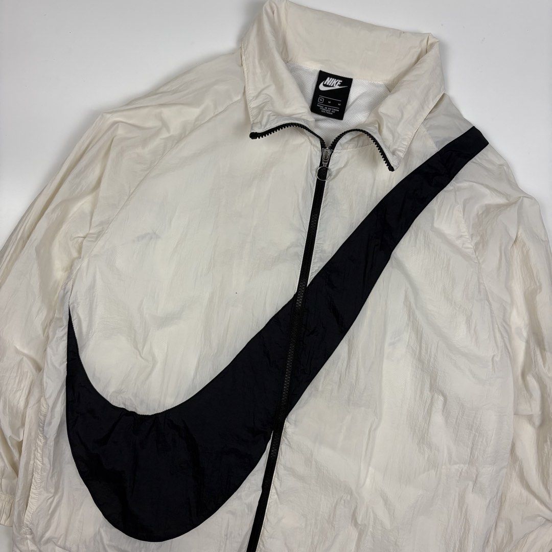 Nike Big Swoosh Jacket Coconut Milk (Category: Coats, Jackets and Outerwear) located in Quezon City. Submitted by 1106_collective (Listing ID 1463232408, Image 3). Description: Size: Meduim Condition: 9/10 Material: 100% Nylon Made in: Vietnam Flaw / Defect: Minor stain Dimension Width: 23” Length: 26.5” Shoulder: 23” Sleeve: 17”.