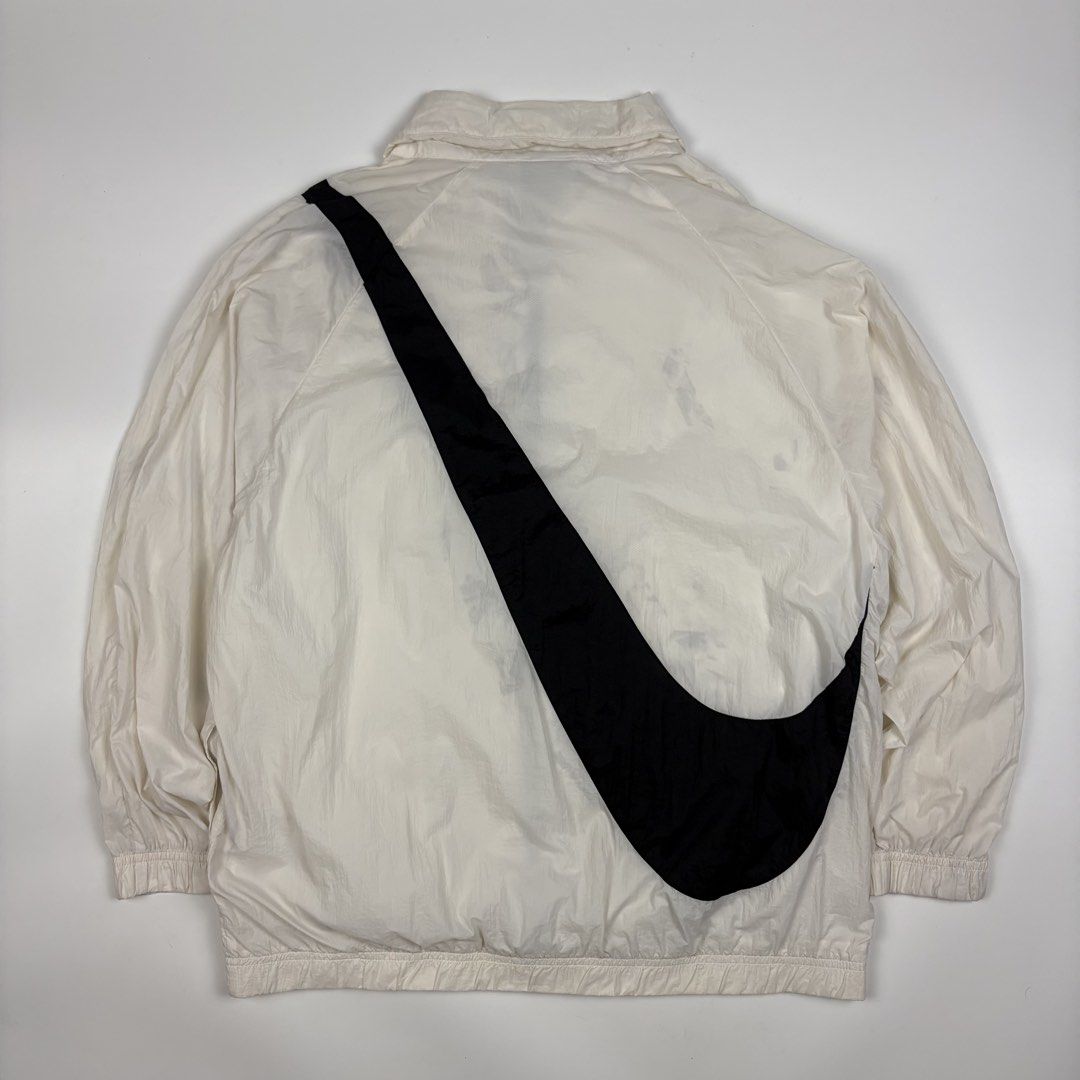 Nike Big Swoosh Jacket Coconut Milk (Category: Coats, Jackets and Outerwear) located in Quezon City. Submitted by 1106_collective (Listing ID 1463232408, Image 2). Description: Size: Meduim Condition: 9/10 Material: 100% Nylon Made in: Vietnam Flaw / Defect: Minor stain Dimension Width: 23” Length: 26.5” Shoulder: 23” Sleeve: 17”.
