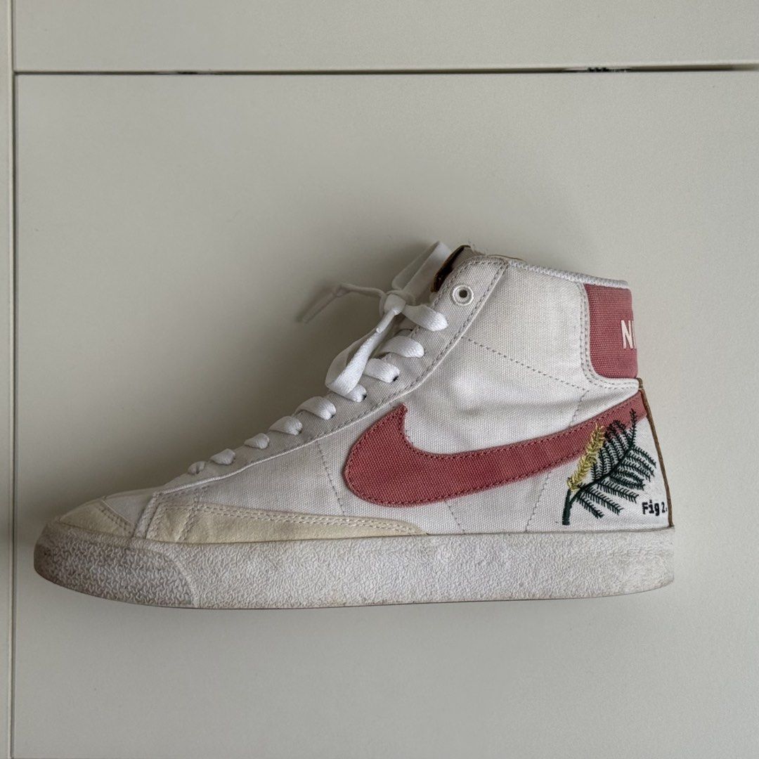 Nike Blazer Mid '77 Fig Tree (size 26.5cm) (Category: Sneakers) located in Taytay. Submitted by gingbns (Listing ID 1463325744, Image 1). Description: - White canvas Nike Blazer Mid '77 - Embroidered fig tree detail on the side - Pink Nike branding on the heel tab - Cork accents on the tongue - Size US 9.5 womens / 26.5 cm - 📍Makati.