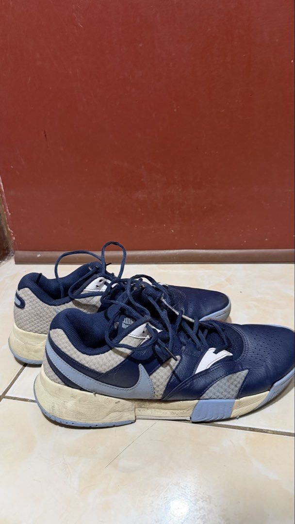 Nike pickle shoes (Category: Sneakers) located in Manila. Submitted by sneakspxxks (Listing ID 1463294511, Image 2). Description: - Brand: Nike - Type: Basketball Shoes - Size: US 11 (UK 10, EUR 45) - Color: Dark Blue with Light Grey and White Accents - Condition: Soles show wear but have plenty of grip. - Laces: Intact - Ideal for: Basketball or casual wear.