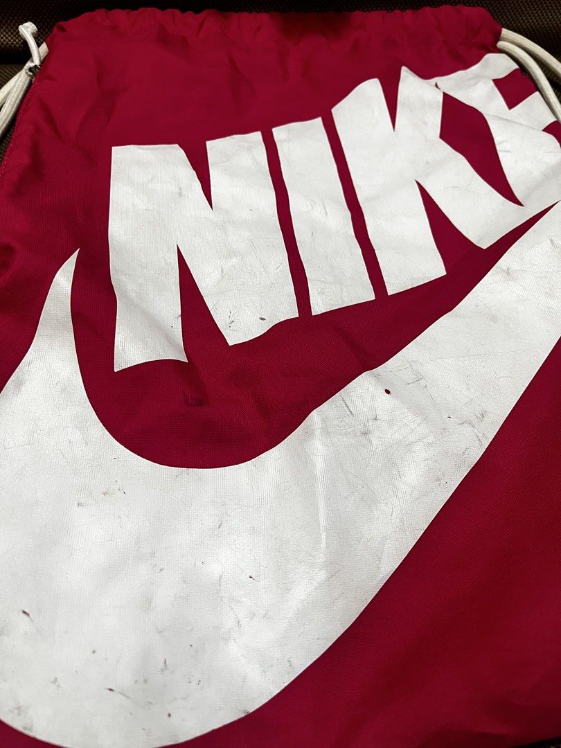 Nike drawstring bag (Category: Cross-body Bags) located in Mandaluyong City. Submitted by kherztan_kherztof_shoppe (Listing ID 1463151750, Image 2). Description: Preloved Minor issue: kindly check photos Rfs: decluttering.