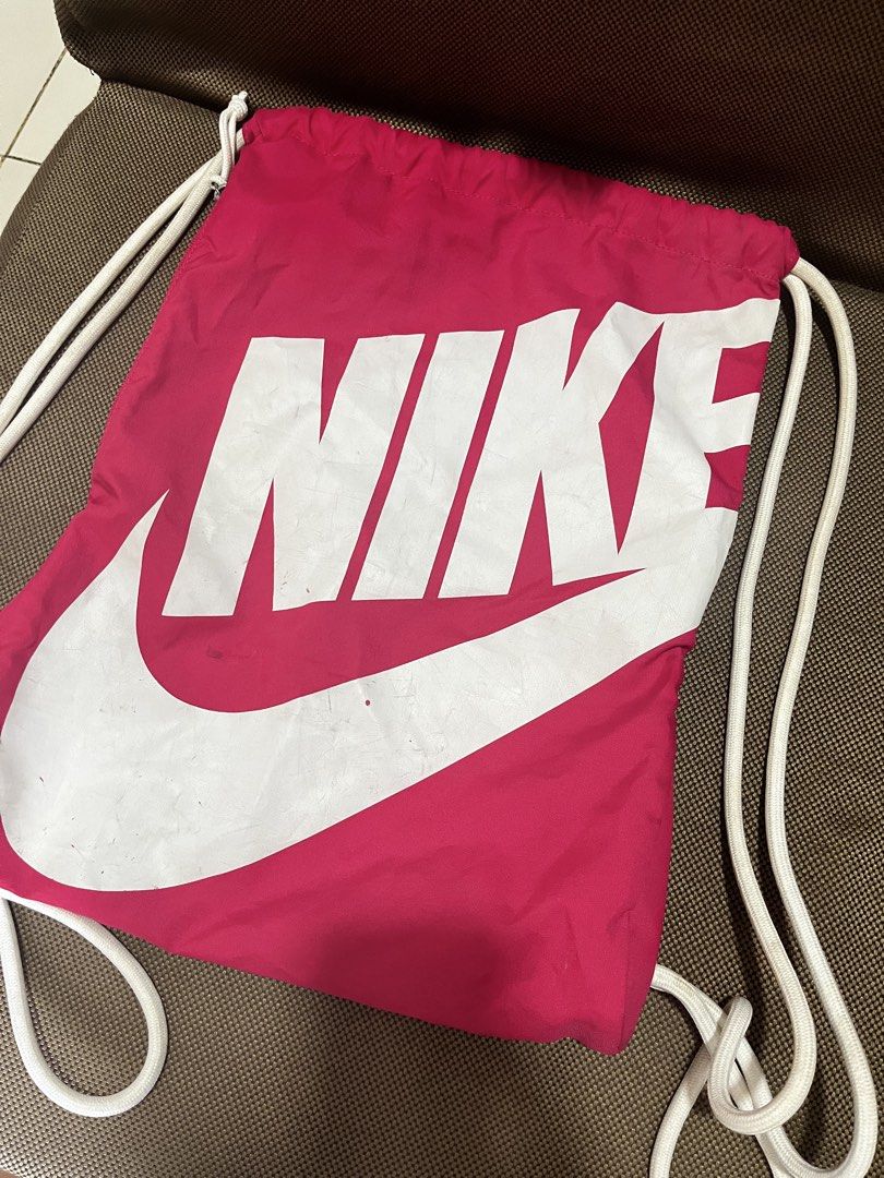 Nike drawstring bag (Category: Cross-body Bags) located in Mandaluyong City. Submitted by kherztan_kherztof_shoppe (Listing ID 1463151750, Image 1). Description: Preloved Minor issue: kindly check photos Rfs: decluttering.