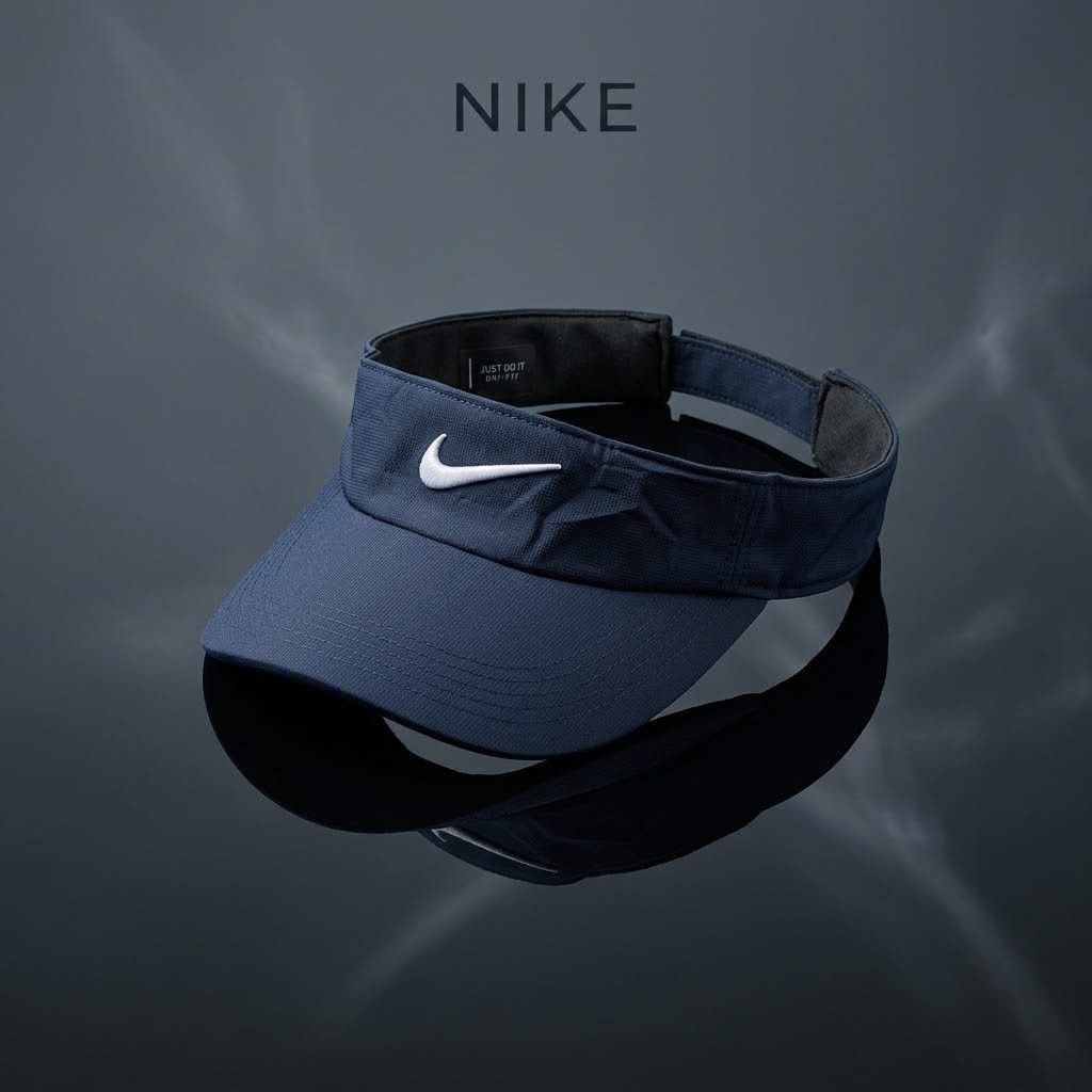 Nike Dri-Fit Golf Visor (Category: Caps & Hats) located in Carmen. Submitted by ar_thrift00 (Listing ID 1463269661, Image 1). Description: - Navy blue Nike visor - Features iconic swoosh logo - Made with Dri-Fit material to keep you cool - Adjustable strap at the back for a comfortable fit - Ideal for sports or sunny days.