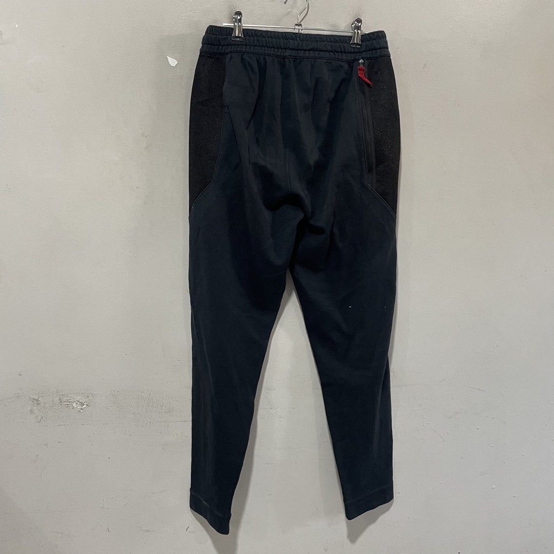 Nike Dri-Fit Jogger Pants Black Size L (Category: Joggers) located in Paombong. Submitted by purefire_ec18f9 (Listing ID 1463158451, Image 2). Description: - Black Nike Dri-Fit Joggers - Size: Large (L) - Features: Elastic waistband with drawstring, side pockets - Design: Mesh paneling on sides with red accents - Versatile: Ideal for workouts or casual wear.