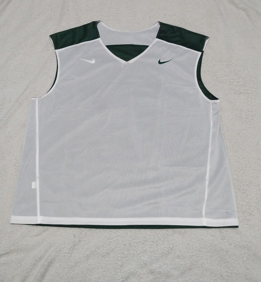 Nike Reversible Tank Top (Category: Activewear) located in Angeles City. Submitted by thehustlersculture (Listing ID 1463231693, Image 3). Description: Nike Reversible green and white -large on tag (american size) -actual dimes width 25 x length 28 -embroided swoosh logo -complete tags -$20 original price -US store bought not thrifted.