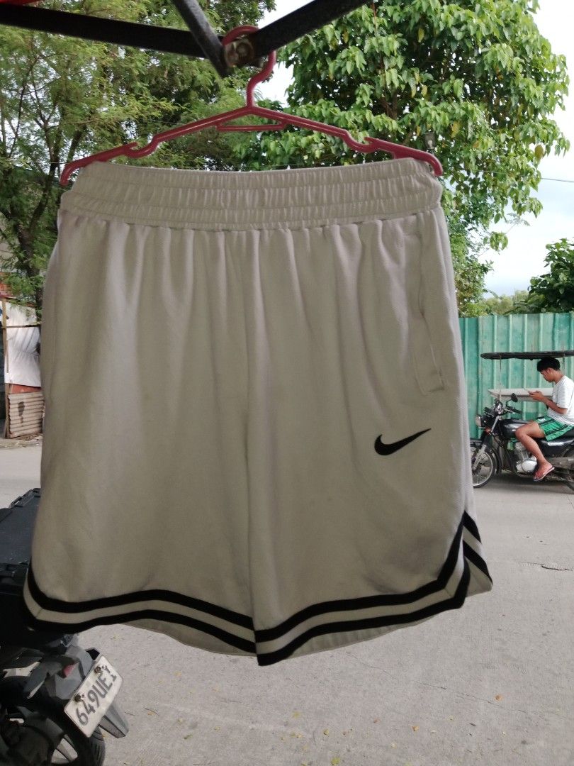Nike white short (Category: Shorts) located in Manila. Submitted by mickmickthriftedshop (Listing ID 1463219139, Image 1). Description: 28to32x16.