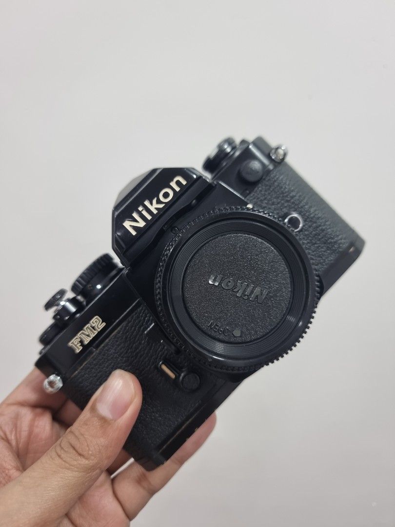 Nikon Fm2 (Category: Cameras) located in San Fernando. Submitted by filmburrrn_ (Listing ID 1463128632, Image 1). Description: Nikon FM2 with body cap and original nikon soft button release. recently cla'd by feelmanila. working meter. bit brassing at the bottom edges. overall is in great condition..