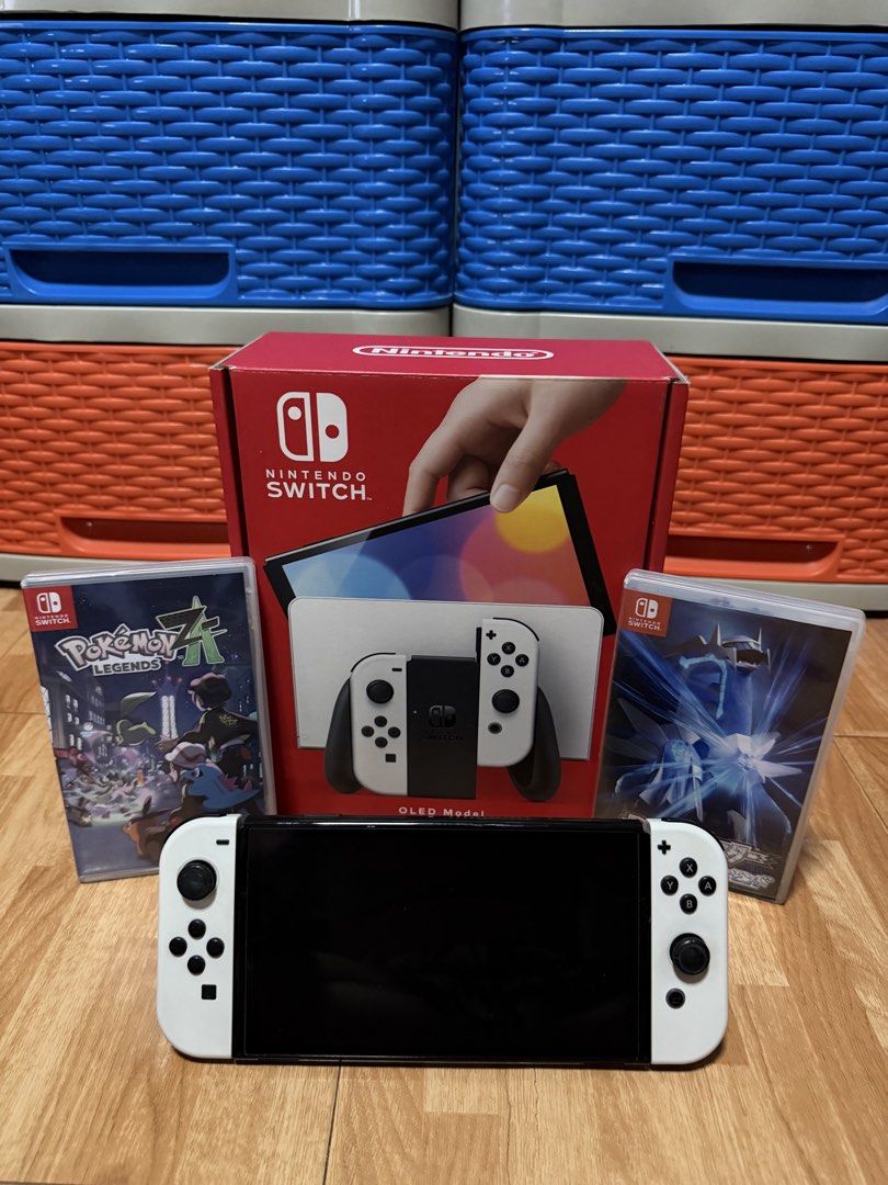 NINTENDO SWITCH OLED WHITE (Category: Nintendo) located in Manila. Submitted by zybolong (Listing ID 1463239572, Image 3). Description: Nintendo Switch OLED (White) with complete Box + accessories and 2 FREE Pokemon Games. Fully tested and perfectly working 💯 Inclusions: Unit Dock HDMI Cable Joycon Grip/Strap San Disk 256 GB SD Card Pokemon Brilliant Diamond Pokemon Legends Z-A Minor Issue: Dock back cover is missing No receipt (Bought December 