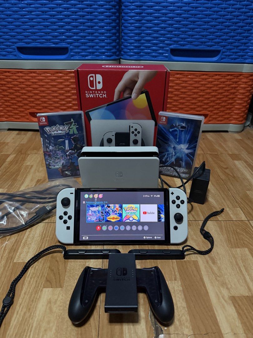 NINTENDO SWITCH OLED WHITE (Category: Nintendo) located in Manila. Submitted by zybolong (Listing ID 1463239572, Image 1). Description: Nintendo Switch OLED (White) with complete Box + accessories and 2 FREE Pokemon Games. Fully tested and perfectly working 💯 Inclusions: Unit Dock HDMI Cable Joycon Grip/Strap San Disk 256 GB SD Card Pokemon Brilliant Diamond Pokemon Legends Z-A Minor Issue: Dock back cover is missing No receipt (Bought December 