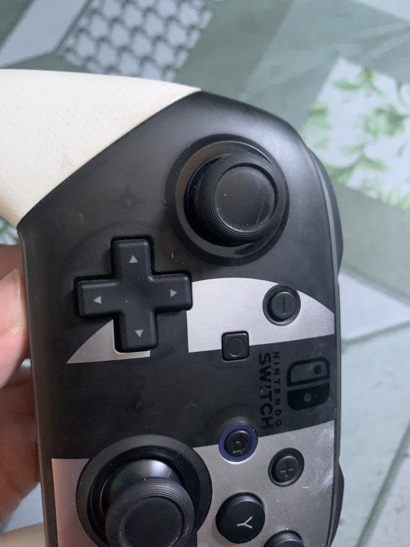 Nintendo Switch Pro Controller - Black/White (Category: Controllers) located in Navotas City. Submitted by recabalesa0 (Listing ID 1463247729, Image 3). Description: - Nintendo Switch Pro Controller - Super mario smash bro edition - Condition: Works great, fully functional Navotas location pickup or lalamove .