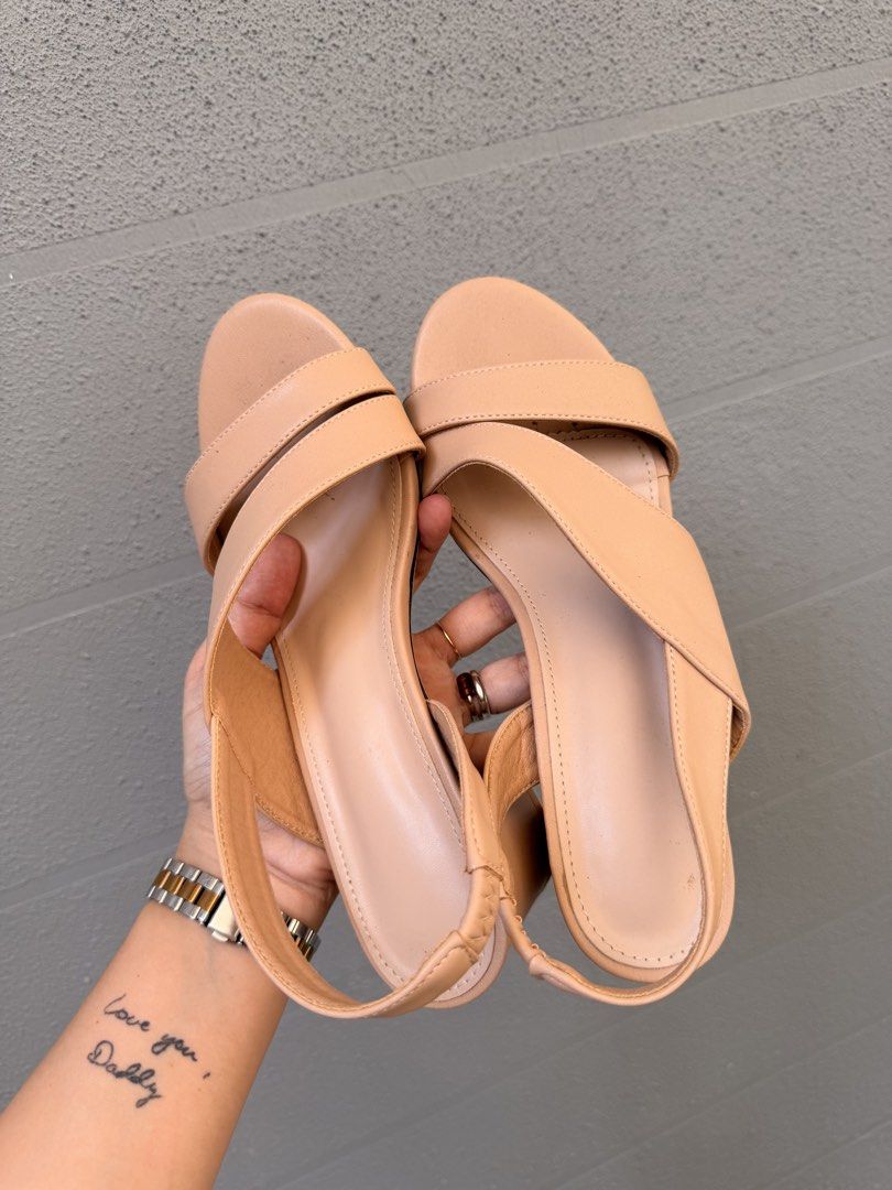 Nude Slingback Block Heels Size 38 (Category: Heels) located in Santa Rosa. Submitted by hello2ndhandlove (Listing ID 1463145717, Image 1). Description: - Nude slingback heels - Block heel - Strappy front design - Elastic strap at the back for a secure fit - Size: 38 - Condition: Lightly worn, some dirt on soles - Perfect for dressing up or down Super comfy used once Rfs: i ordered 2 very similar designs.