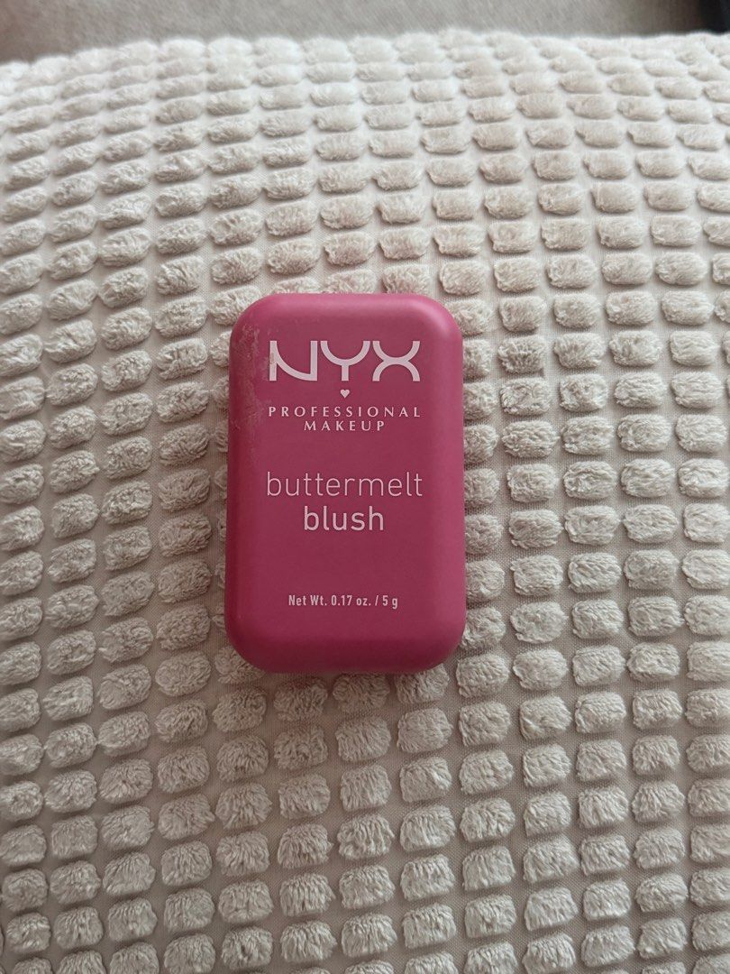 NYX Professional Makeup Buttermelt Blush (Category: Makeup) located in Pasig City. Submitted by zenowl.61105a (Listing ID 1463200764, Image 1). Description: - NYX Buttermelt Blush - Vibrant pink shade - Unique textured powder surface - Compact and portable design - Perfect for adding a pop of color to cheeks.