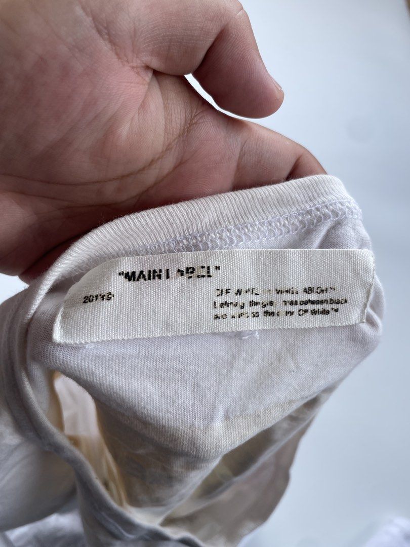 off white fire tape tee (Category: Tshirts & Polo Shirts ) located in General Mariano Alvarez. Submitted by savenlester (Listing ID 1463165207, Image 3). Description: Off white fire tape tee ◾W - 21 ◾L - 29 ◾Good condition ◾Color rate 9/10 .