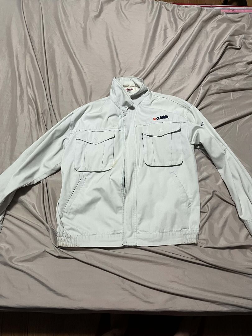 OGAWA Work Jacket (Category: Coats, Jackets and Outerwear) located in Mendez-Nunez. Submitted by franz321vi79284 (Listing ID 1463317581, Image 1). Description: - Light grey OGAWA work jacket - Two chest pockets with button closures - Two side pockets - Elasticated cuffs and hem - Zipper closure - Ideal for work or casual wear.
