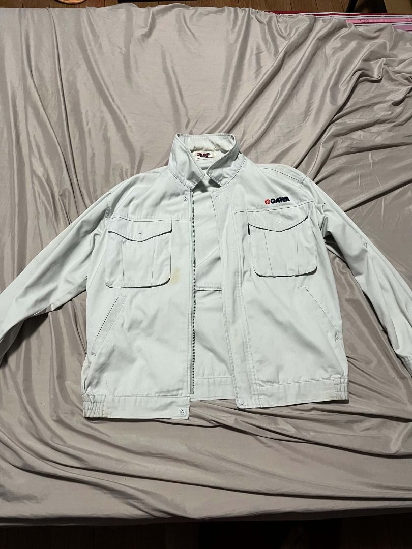 OGAWA Work Jacket (Category: Coats, Jackets and Outerwear) located in Mendez-Nunez. Submitted by franz321vi79284 (Listing ID 1463317581, Image 3). Description: - Light grey OGAWA work jacket - Two chest pockets with button closures - Two side pockets - Elasticated cuffs and hem - Zipper closure - Ideal for work or casual wear.