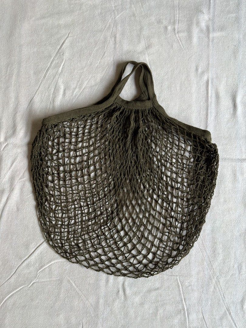Olive Green String Net Shopping Bag (Category: Tote Bags) located in Quezon City. Submitted by sayshops (Listing ID 1463230698, Image 1). Description: Reusable net bag Dark olive green like new. used once.