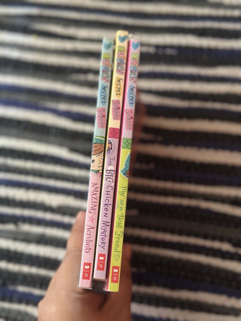 Olivia's Secret Scribbles Book Set (Category: Children's Books) located in Baguio. Submitted by cherylcaps95 (Listing ID 1463125923, Image 3). Description: - Set of 3 Olivia's Secret Scribbles books - Titles: 'Amazing Acrobats', 'The Big Chicken Mystery', 'My New Best Friend' - Ideal for young readers who enjoy stories - Pages are clean and intact - Ready for a new home 250 set.