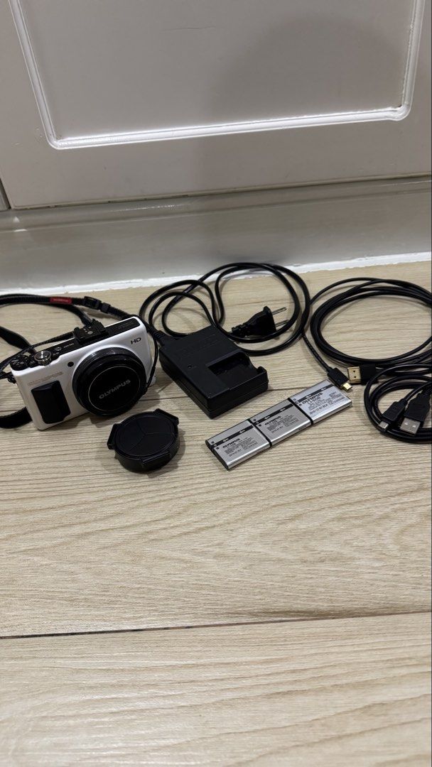 Rare Olympus XZ-1 White Digital Camera + 3 Batteries & Accessories (Category: Cameras) located in Quezon City. Submitted by niksellsss (Listing ID 1463288317, Image 2). Description: Rare white Olympus XZ-1 digital camera set. Tested and working. Camera, lens, zoom, flash, buttons, screen, and battery charging are functional. Included: - Olympus XZ-1 White - 3 Olympus batteries - Original battery charger - Lens cap - Camera strap - Cables shown in