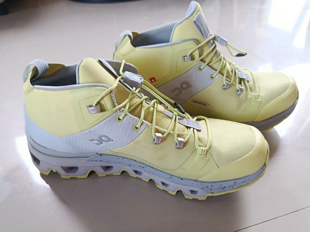 On Cloudtrax Waterproof (Category: Boots) located in Santa Fe. Submitted by thrift_shopph (Listing ID 1463173324, Image 3). Description: pair of On Cloudtrax Waterproof hiking shoes in the "Glacier/Zest" (yellow and grey) colorway, featuring a speed-lacing system. TAWAD lang!!!.