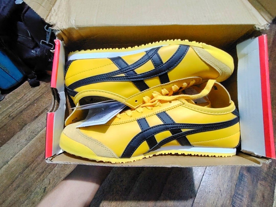 Onitsuka Tiger Mexico 66 Yellow Black (Category: Sneakers) located in Pasig City. Submitted by BeyondLifeStylePH (Listing ID 1463129841, Image 1). Description: - Classic Onitsuka Tiger Mexico 66 - Vibrant bright yellow with iconic black stripes - Features suede toe cap and heel - Clean white sole - Comes with original box and tags - Ideal for casual wear and everyday styling - Size 10 - Pasig area location - Negotiable.