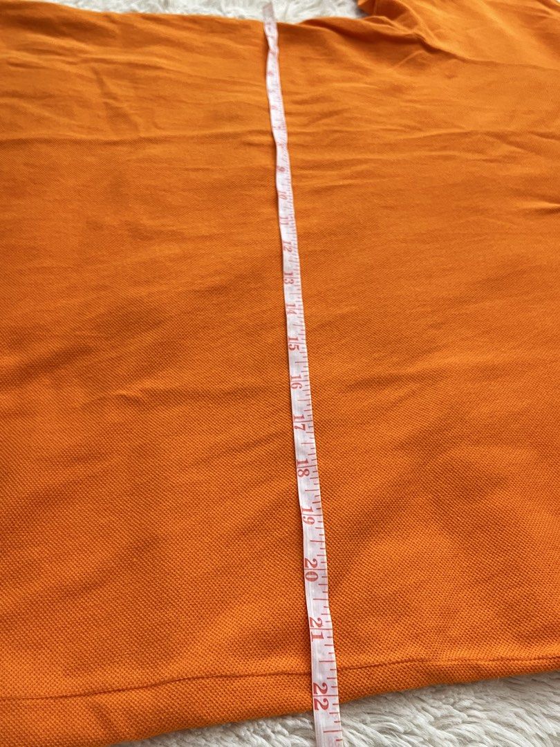 Orange Lacoste Polo Shirt Size 6 (Category: Tshirts & Polo Shirts ) located in General Santos City (Dadiangas). Submitted by crisjayg (Listing ID 1463324610, Image 3). Description: - Classic orange Lacoste polo shirt - Features iconic crocodile logo on chest - Made in El Salvador - Tag size: 6 - Measurements: Approx. 30" length, 22" chest - Ideal for casual wear or a sporty look.