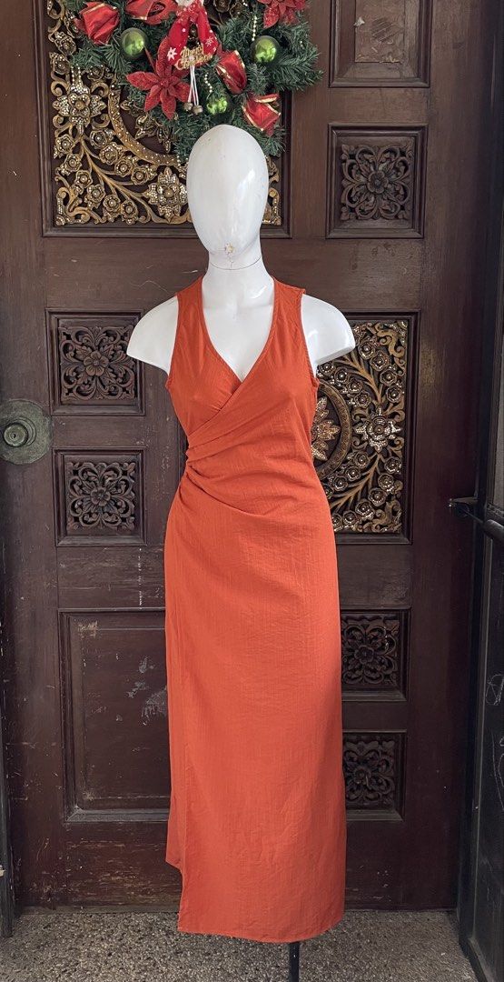 Orange Wrap Maxi Dress (Category: Dresses) located in Quezon City. Submitted by venizia (Listing ID 1463224839, Image 1). Description: - Orange midi dress - Flattering wrap style - Sleeveless with V-neckline - Textured fabric - Versatile for casual or dressy occasions - Comfortable and easy to wear.