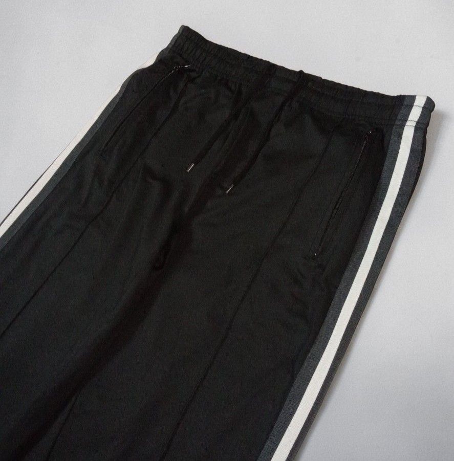 Our Legacy - Cristopher Nying - Side Taped Track Pants (Category: Joggers) located in Manila. Submitted by kinstugi.pieces (Listing ID 1463285077, Image 2). Description: Sizes: L-XL Men's (48) Dimes: 16 inches, Wdth 9.5 inches, Crtch 31.5 inches, Insm 42 inches, Lngth 9 inches, LG Opng Authentic/Legit Pls check every picture details by detail for info. Color Rate: 9.5/10 Condition: 9.5/10 Presentable to Use Add Shipping fee.