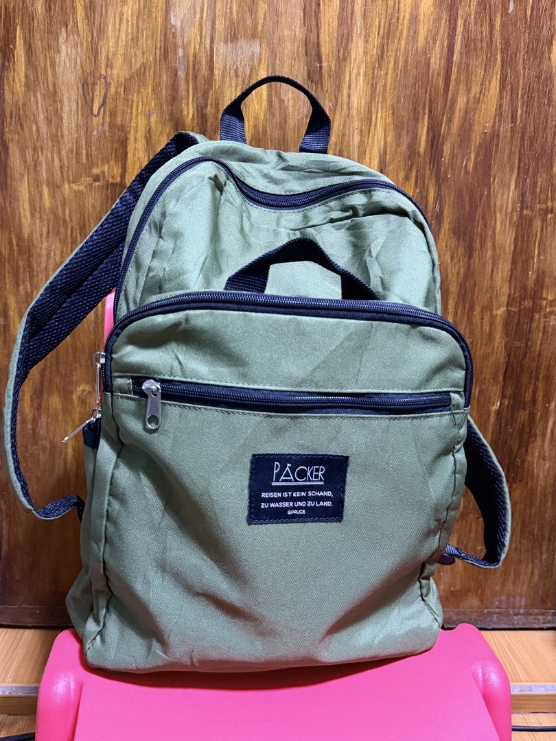 PACKER backpack (Category: Backpacks) located in Paete. Submitted by skydruemadison (Listing ID 1463264097, Image 1). Description: - PACKER green backpack - Main compartment - Front zip pocket - Side pockets - Padded back for comfort - Ideal for everyday use or travel - Zippers in good working condition with cup and umbrella pockets inside.