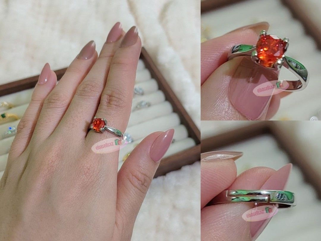 Padparascha Ring - Vibrant Sunset-Orange Solitaire Ring (Category: Rings) located in Basista. Submitted by einasellsxz (Listing ID 1459872318, Image 1). Description: Add a fiery pop of color to your look with this stunning sunset-orange gemstone ring. Features an intense, brilliant round-cut stone in a classic four-prong solitaire setting that mimics the rare radiance of a Padparadscha sapphire. Band: Sleek, polished silver-tone metal Fit: Adjust