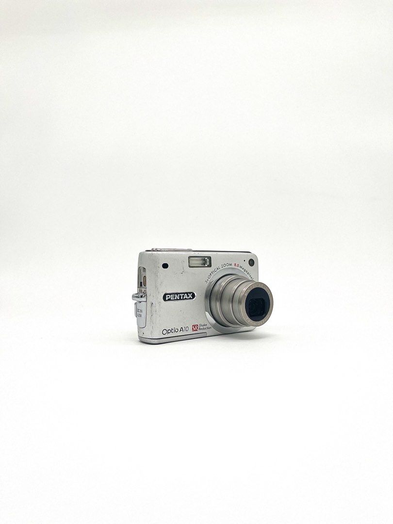Pentax Optio A10 8.0 MP Digital Camera (Category: Cameras) located in Cebu City. Submitted by guttathreads (Listing ID 1463178215, Image 2). Description: Pentax Optio A10 8.0 MP Digital Camera BODY CONDITION: 8/10 ＊ 8.0 MP CCD sensor ＊ 2.5-inch LCD screen ＊ 3x optical zoom (38–114mm equivalent) ＊ Shake Reduction ＊ Built-in flash ＊ Face Detection ＊ Video recording ＊ Uses SD / SDHC memory card ＊ Rechargeable battery FULLY FUNCTIONAL! HONEST ISSUES: