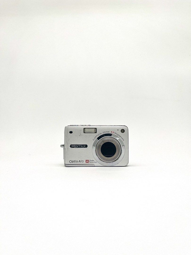 Pentax Optio A10 8.0 MP Digital Camera (Category: Cameras) located in Cebu City. Submitted by guttathreads (Listing ID 1463178215, Image 1). Description: Pentax Optio A10 8.0 MP Digital Camera BODY CONDITION: 8/10 ＊ 8.0 MP CCD sensor ＊ 2.5-inch LCD screen ＊ 3x optical zoom (38–114mm equivalent) ＊ Shake Reduction ＊ Built-in flash ＊ Face Detection ＊ Video recording ＊ Uses SD / SDHC memory card ＊ Rechargeable battery FULLY FUNCTIONAL! HONEST ISSUES: